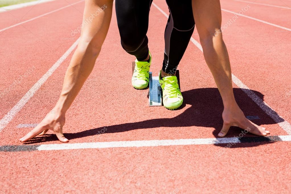 Depositphotos 110787840-stock-photo-athlete-on-starting-block-about